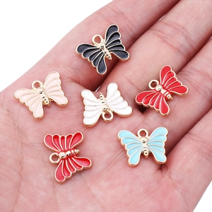 Handheld set of colorful enamel butterfly pendants for DIY jewelry and necklaces