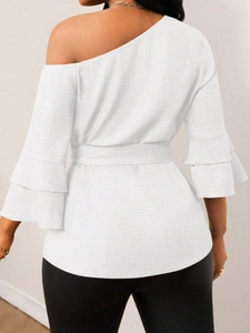 White one-shoulder denim-effect blouse with layered ruffle sleeves and a waist tie-belt