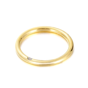 Minimalist gold stainless steel ring with a single micro-set crystal on white background