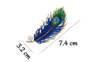 Detailed peacock feather brooch with blue enamel inlay and a white round pearl