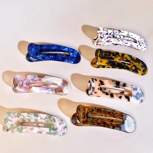 Set of 7 premium acetate hair claws with marble and tortoiseshell patterns for elegant styling