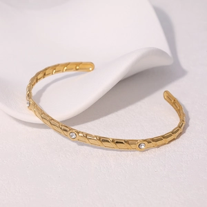 Fashionable 18K gold plated stainless steel twisted open bangle with round crystal stones