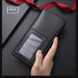 Close-up of black leather long wallet featuring a clear ID window and fine stitching