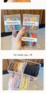 Détail de 50 élastiques à cheveux haute élasticité colorés dans une boîte transparente