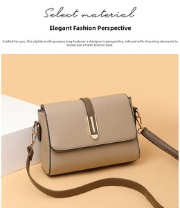 Detail of beige textured leather handbag featuring gold clasp and brown shoulder strap