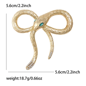 Fashion alloy snake bow brooch with green crystal eyes and rhinestones in gold finish