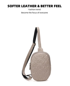 Detail showing khaki star quilted leather texture and silver zipper on chest bag