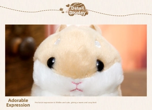Close-up of cute plush hamster keychain featuring soft fur and embroidered facial details