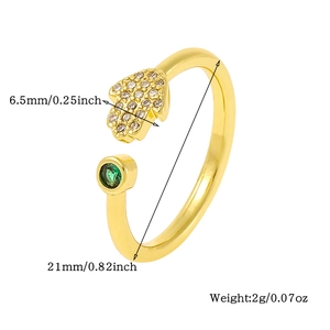 Detail view of gold Hamsa Hand ring with emerald gemstone and size measurements