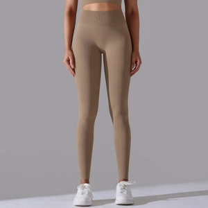 Detail of khaki high-waisted seamless yoga leggings with ribbed tummy control waistband