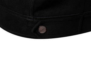 Macro view of classic engraved metal button on black suede texture men jacket