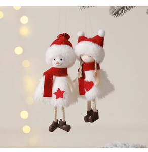 Detail of plush Christmas snowman and angel dolls with soft faux fur and red knits