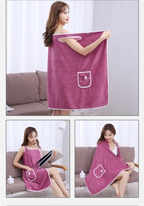 Detail showing the purple coral fleece wearable bath towel with armholes and a pocket