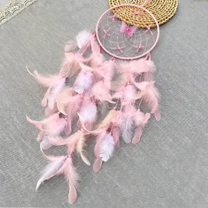 Handmade pink dream catcher with gradient feathers and butterfly for room wall decor