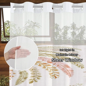 Sheer white waffle shower curtain with feather leaf prints and metal grommets for privacy