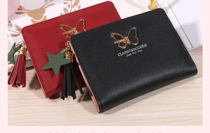 Short faux leather bifold wallets in red and black with tassel and bow details