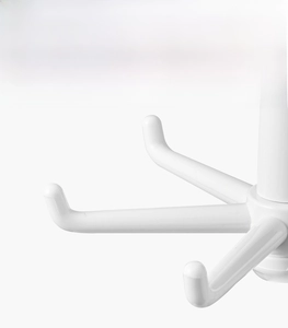Close-up of smooth white rotating kitchen hooks with rounded tips to protect items