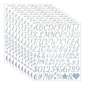 Close-up of silver glitter alphabet and number stickers for graduation cap decoration