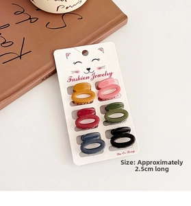 Detail of 6-piece Morandi mini hair claw set on display card showing 2.5cm size