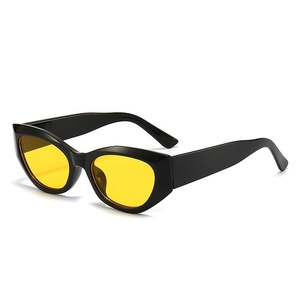 Retro thick black frame sunglasses with vibrant yellow lenses in a side view profile
