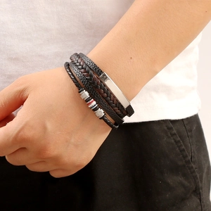 Men's multilayer braided leather bracelet with magnetic alloy clasp shown on wrist