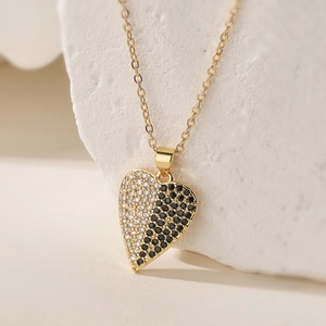 Elegant 18K gold plated heart necklace with black and white pavé cubic zirconia