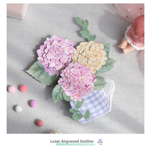 Detailed laser-cut edges of 3D hydrangea paper flower sculpture in a blue checkered vase