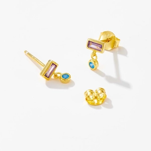 Detail of S925 silver gold-plated stud earrings with purple square and blue round stones