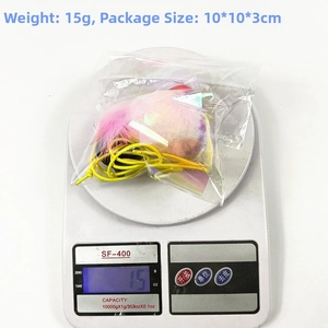 Weight measurement of cat caterpillar toy in packaging, 15g product on digital scale