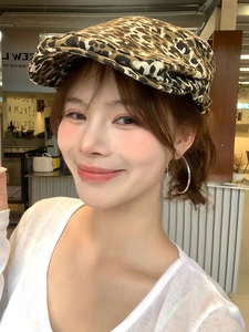Close-up of stylish leopard print newsboy cap made of thick premium fabric for women