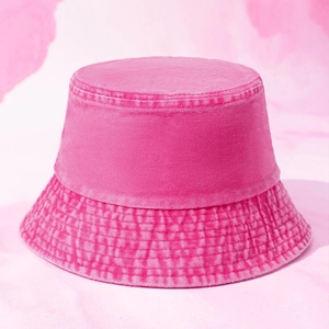 Detail of rose pink washed denim bucket hat with reinforced stitching and vintage texture