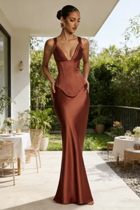Close-up of bronze satin maxi dress showing corset style bodice and shimmering fabric detail