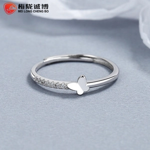 Detailed macro of a 925 sterling silver ring with a polished butterfly and cubic zirconia