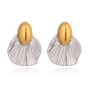Detail of creative geometric leaf earrings with gold and silver two-tone metallic texture
