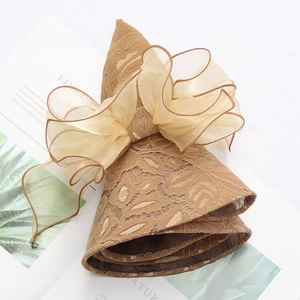 Elegant brown lace sun hat with organza bow and wide brim for UV protection
