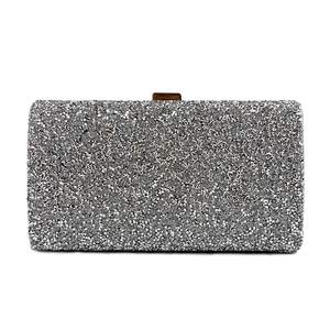 Detailed close-up of a silver rhinestone rectangular evening clutch bag with shimmer texture