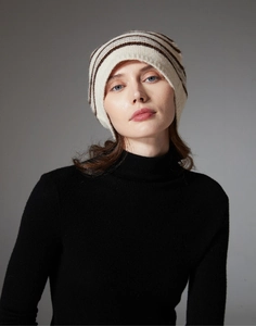 Close-up of soft ribbed knit texture and striped pattern on the winter wool beanie