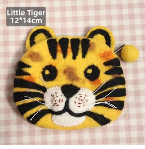 Detail of tiger-shaped wool felt coin purse measuring 12x14cm with yellow pompom zipper