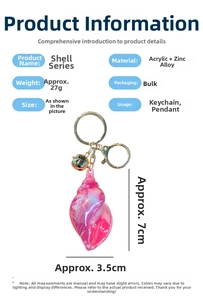 Iridescent pink conch keychain detail showing 7cm height and 3.5cm width measurements