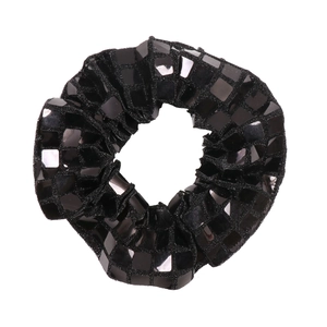 Detail of black scrunchie with shiny square sequins and textured 3D pleated design