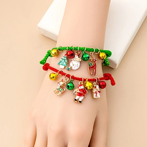 Close-up of adjustable woven Christmas bracelet with bells and festive alloy charms