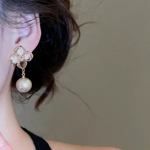 Elegant gold-plated flower stud earrings with zirconia petals and hanging pearl for women