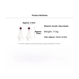 Detail view showing floral tassel earrings with acrylic petals and size measurements