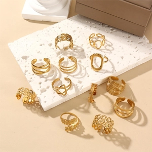 12-piece 18k gold plated adjustable leaf and geometric ring set on stone display