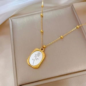 Minimalist gold necklace with a square rose pendant on a beaded chain for women