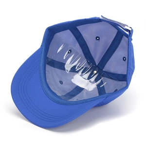Detail of blue dinosaur kids cap showing breathable interior and adjustable back strap