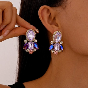 Vintage gold earrings with purple oval crystals and blue rhinestone fringe for women