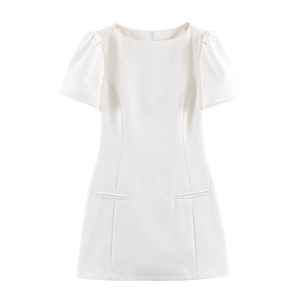 Detail of white A-line mini dress showing round neck and decorative faux pockets