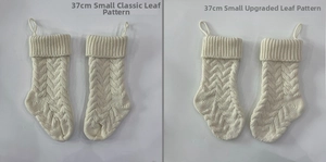 Close-up of cream white knitted Christmas stockings with detailed cable stitch patterns