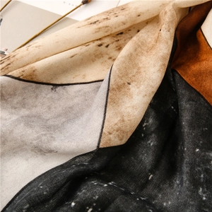 Close-up of abstract geometric print scarf showing detailed cotton linen texture and folds
